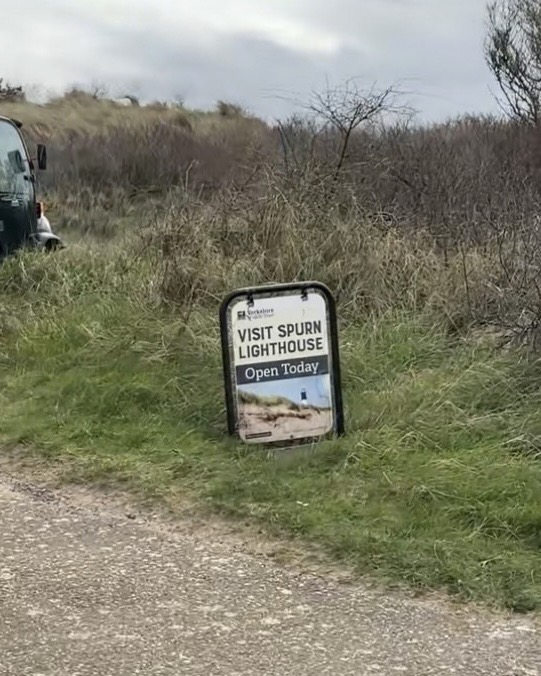 A sign saying 'Visit Spurn Lighthouse'