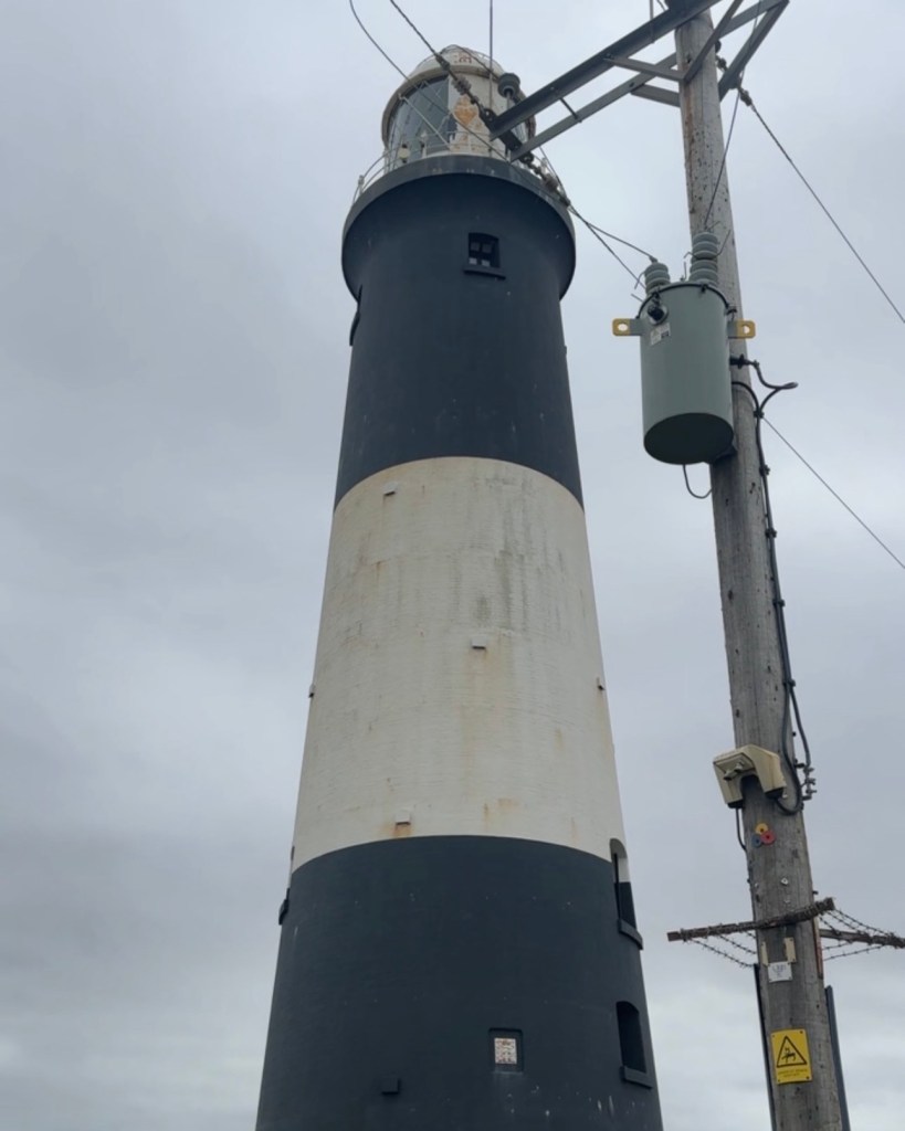 Spurn Point High Lighthouse, with black and white stripes.