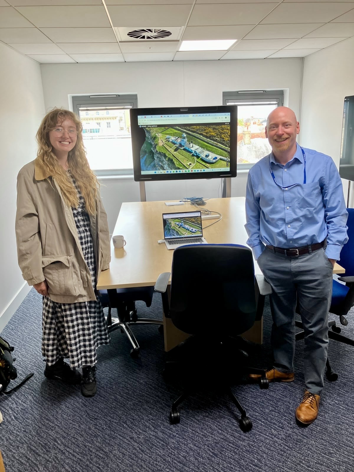 Annie and Matt standing next to one of Trinity House's 3D models